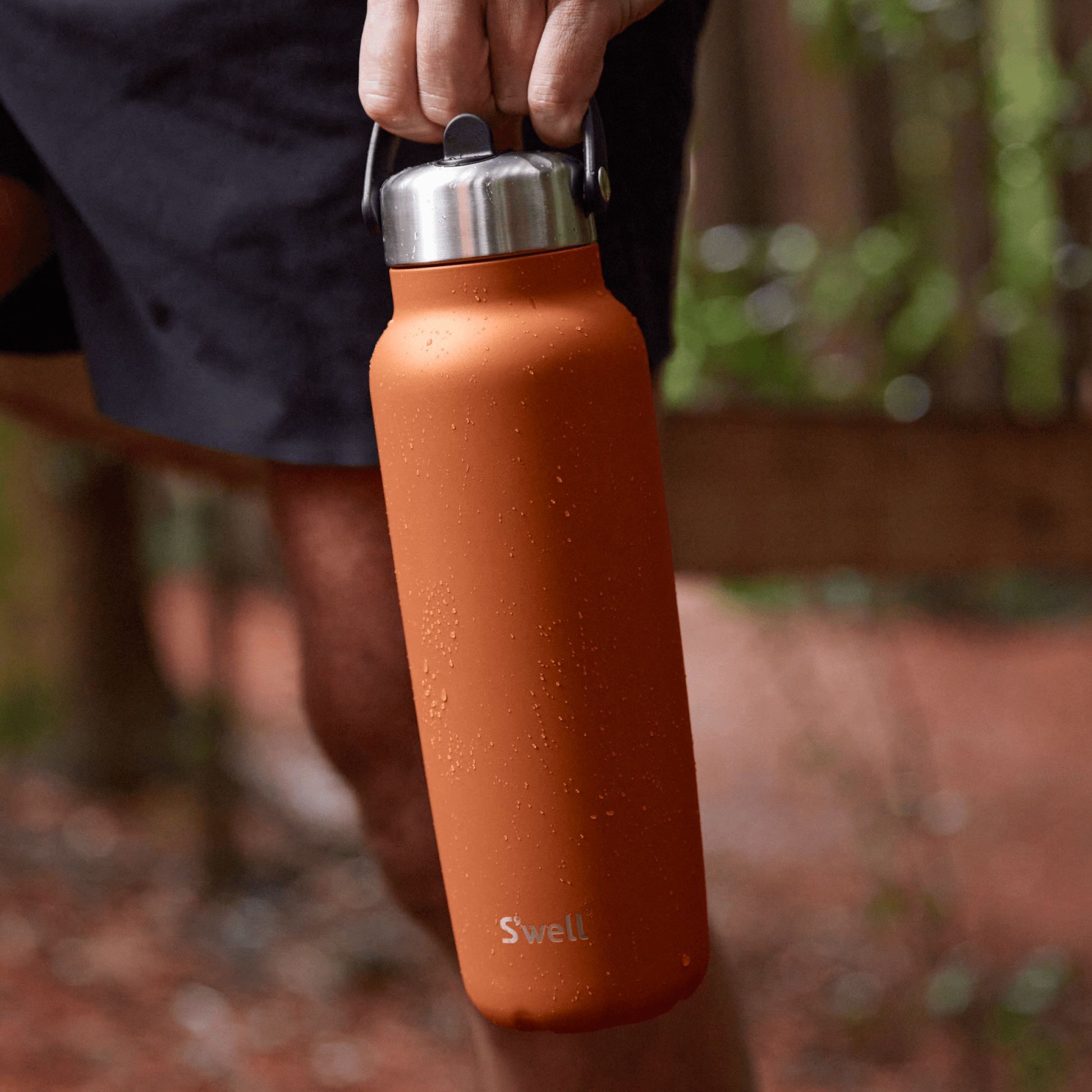 explorer-with-flip-straw-lid-40oz-a4 Swell-Explorer-Water-Bottle-40oz-Orange-Carnelian-LifeStyle.png